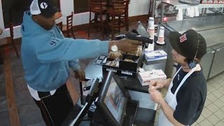 Watch Unfazed Cashier Keep His Cool During Terrifying Gunpoint Robbery [upl. by Neeluj650]